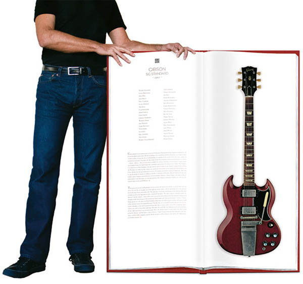 Giant book of photos of life size guitars